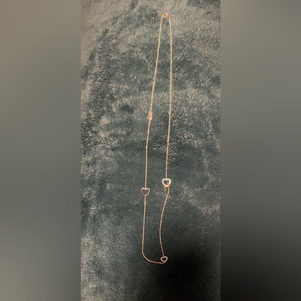 Authentic Gold coach long necklace with faux diamonds heart details